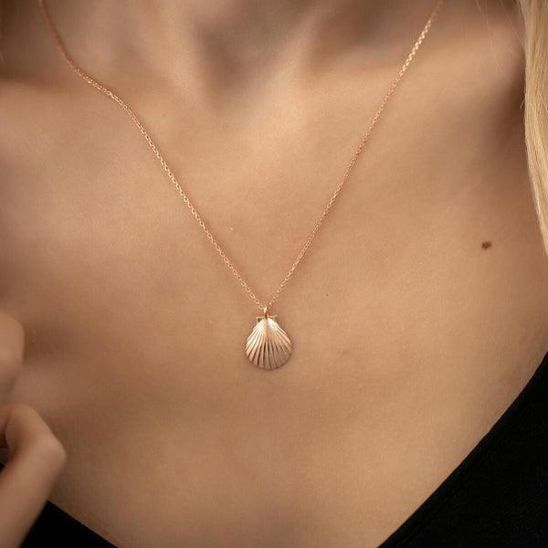 Gold seashell online pendant