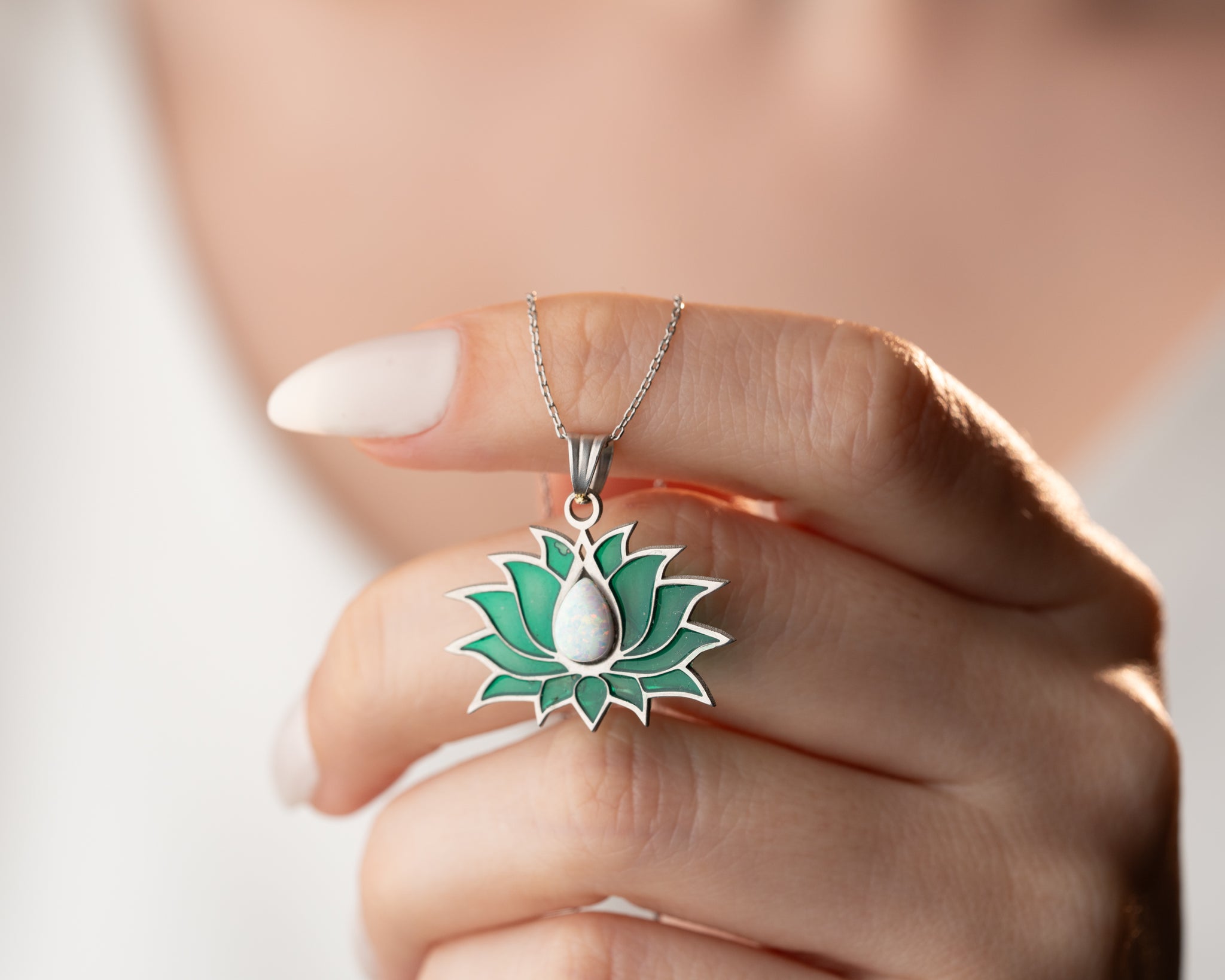 Sunlight passing through a delicate stained glass floral pendant, enhancing its ethereal glow.